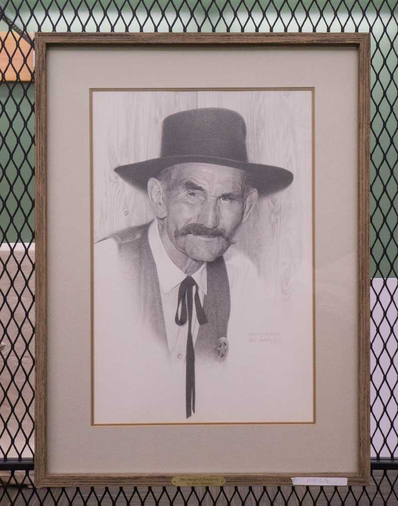 Depicts pencil drawing of man in