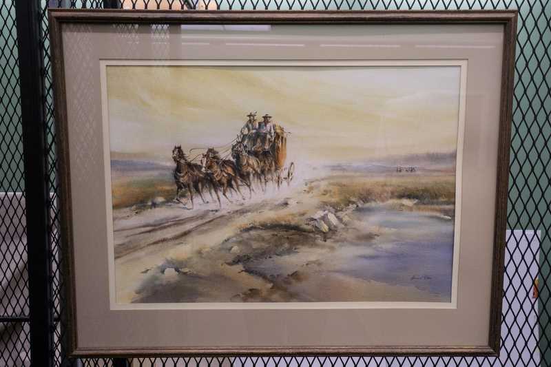 Depicts horse drawn stagecoach w