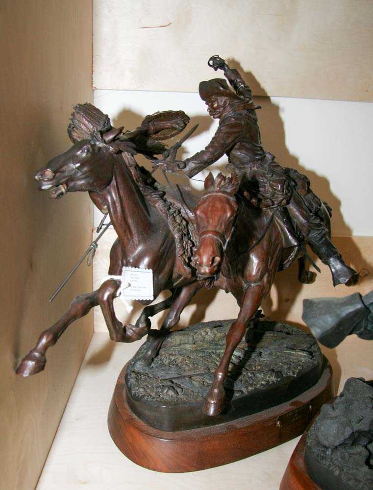 Bronze casting depicting rider o