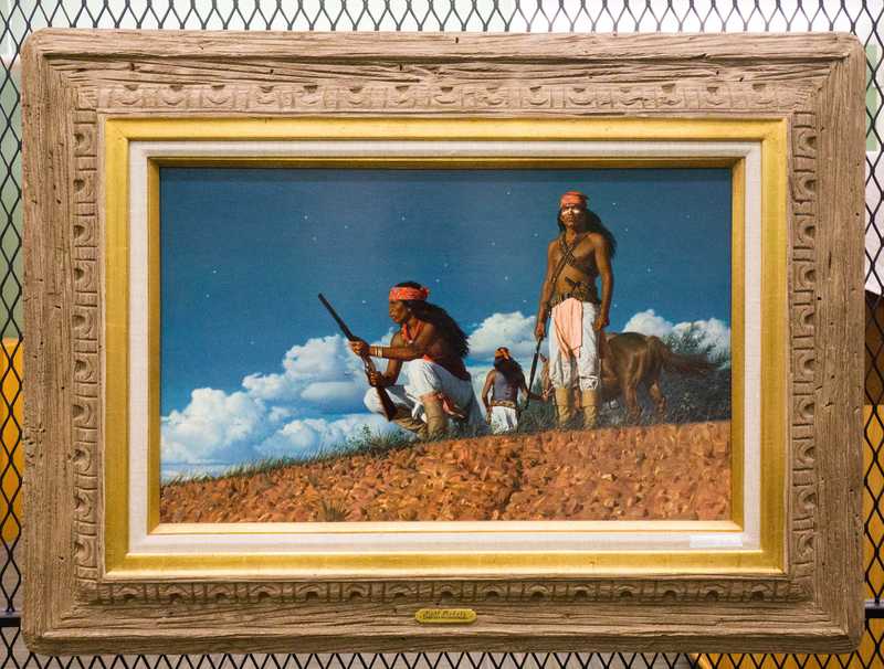 Depicts American Indians, posed